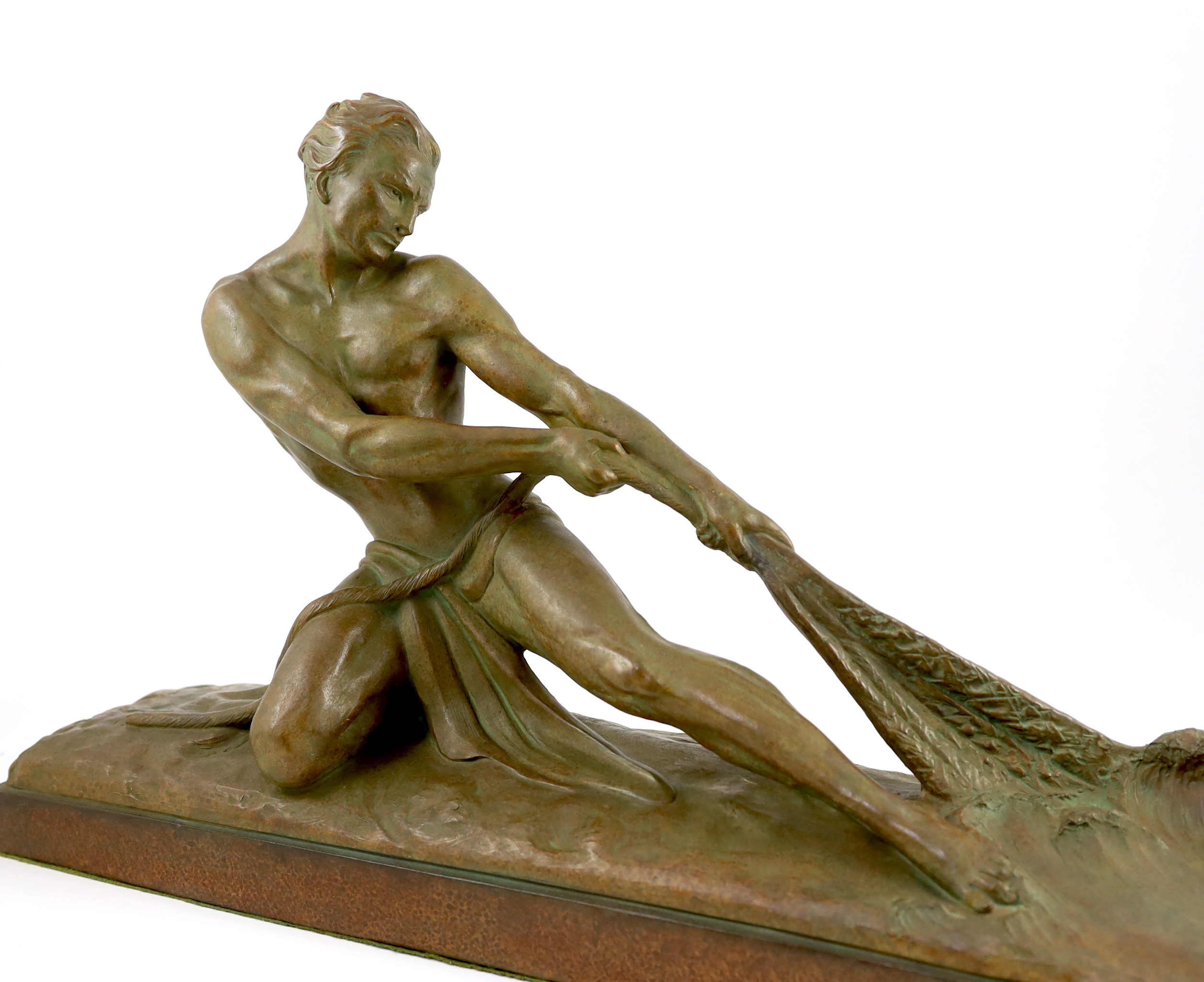 Ugo Cipriani (1887-1960). An Art Deco bronzed terracotta figure of a fisherman hauling a net from the sea, 69cm wide, 18cm deep, 39cm high